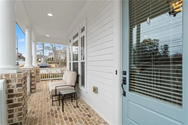 a view of a large trees with wooden fence