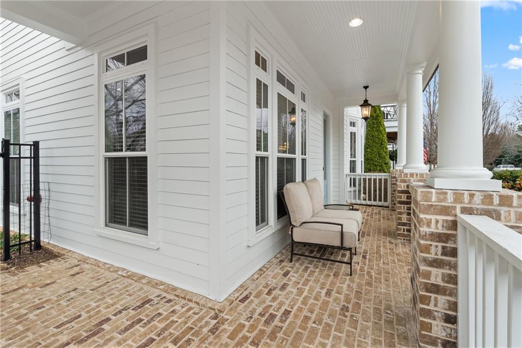 98 Academy Street Alpharetta, GA 30009 - Photo 42 of 56 a view of a patio with chair and tables