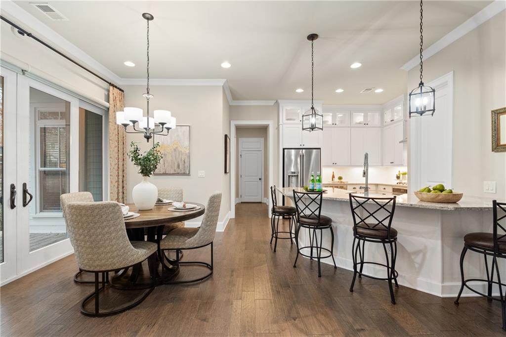 98 Academy Street Alpharetta, GA 30009 - Photo 5 of 56 a view of a dining room with furniture window and wooden floor