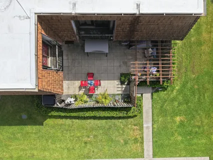 a backyard of a house with seating space