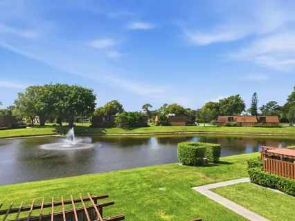 a view of a lake with a yard