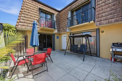 a view of an chairs and table in the patio