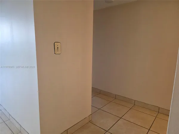 a view of a livingroom and a bathroom