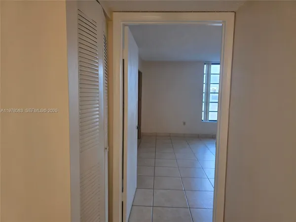 a view of an empty room and window