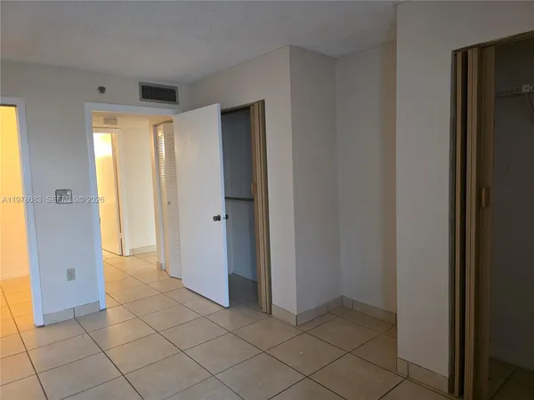 an empty room with wooden door