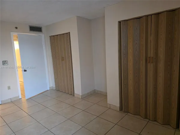a view of a bathroom with a tub and shower