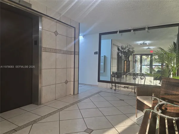 a view of a hallway with a window