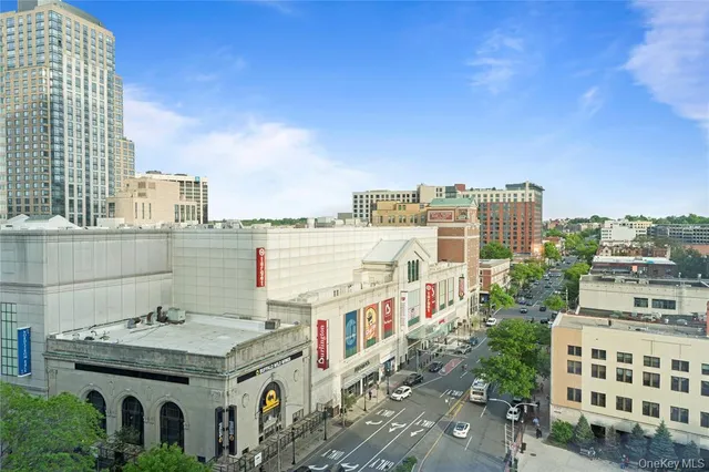 a view of a room with gym equipment and mirrors