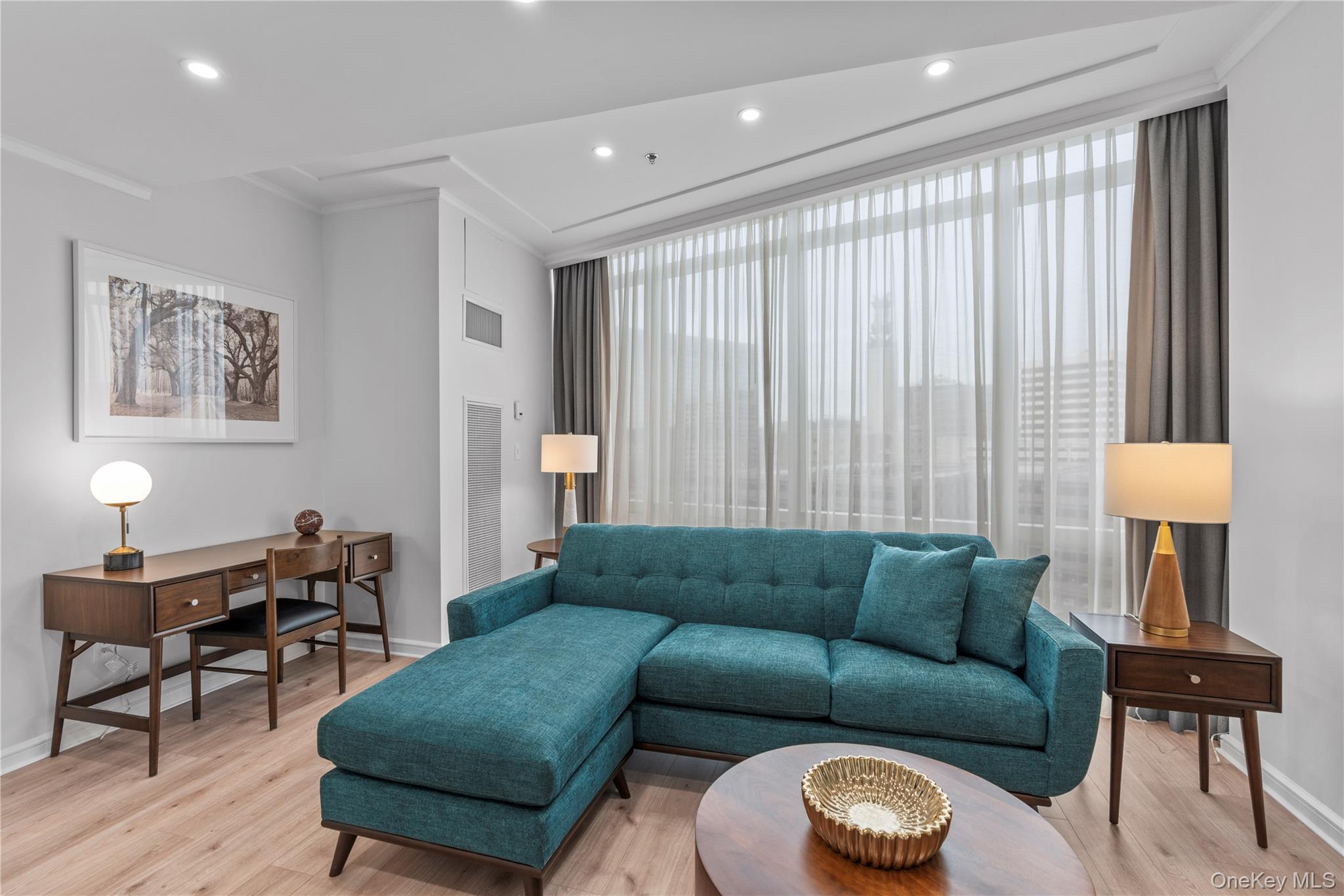 1 Renaissance Square, Unit 10H White Plains, NY 10601 - Photo 4 of 22 a living room with furniture and a large window