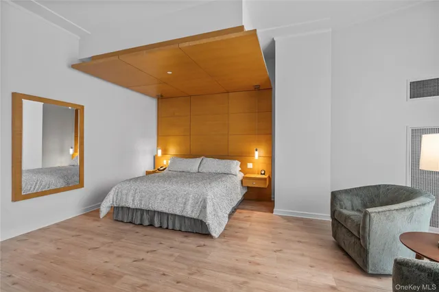 a bedroom with a bed and window