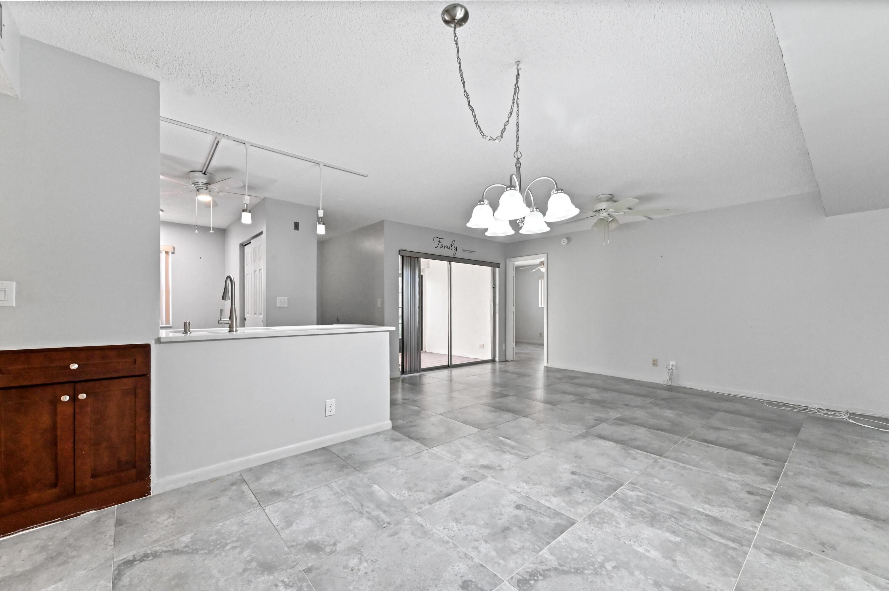 14895 Builtmore Way, Unit 107 Delray Beach, FL 33446 - Photo 14 of 40 a view of a chandelier in a room