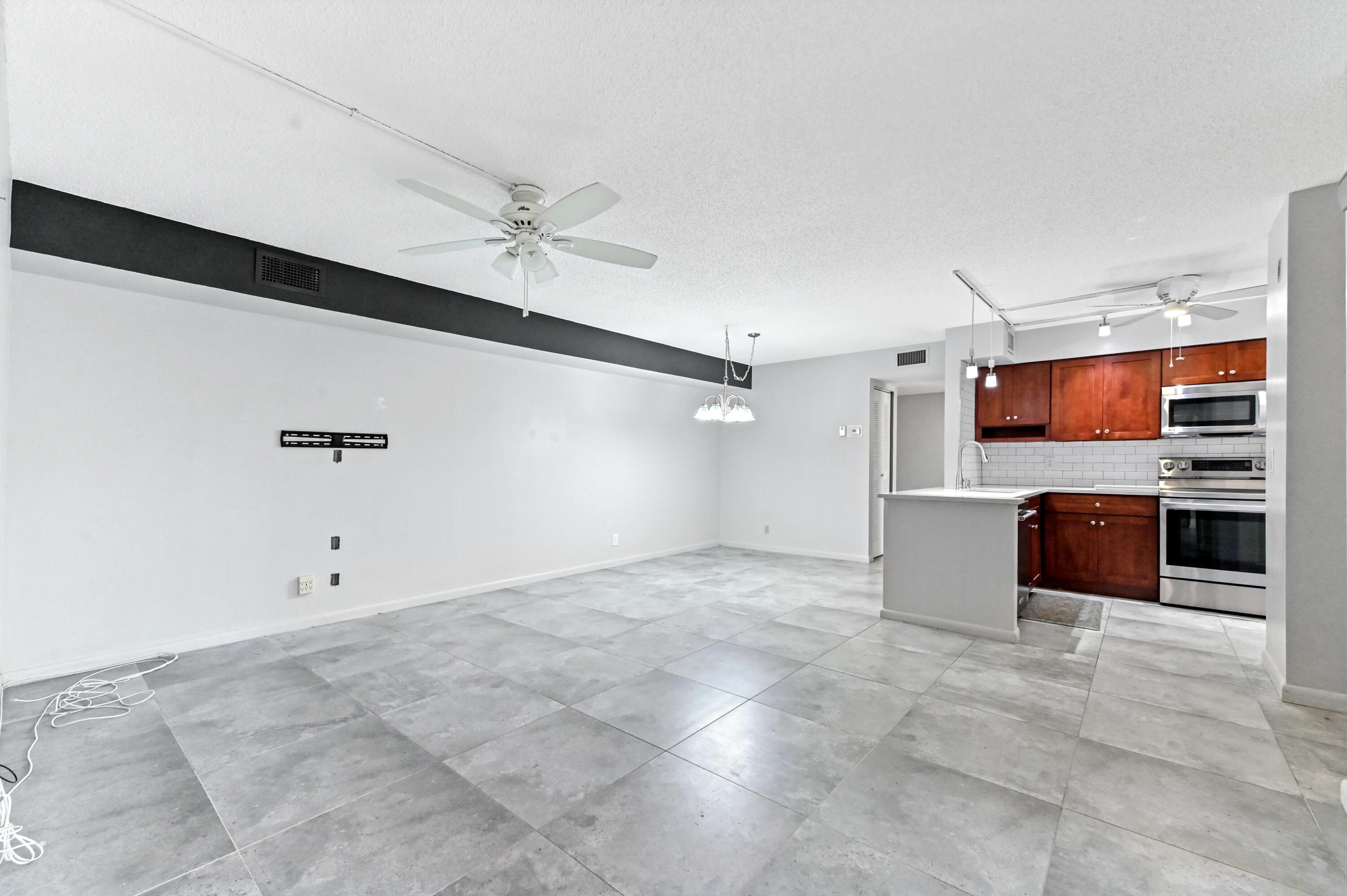 14895 Builtmore Way, Unit 107 Delray Beach, FL 33446 - Photo 15 of 40 a view of a kitchen with electric equipment
