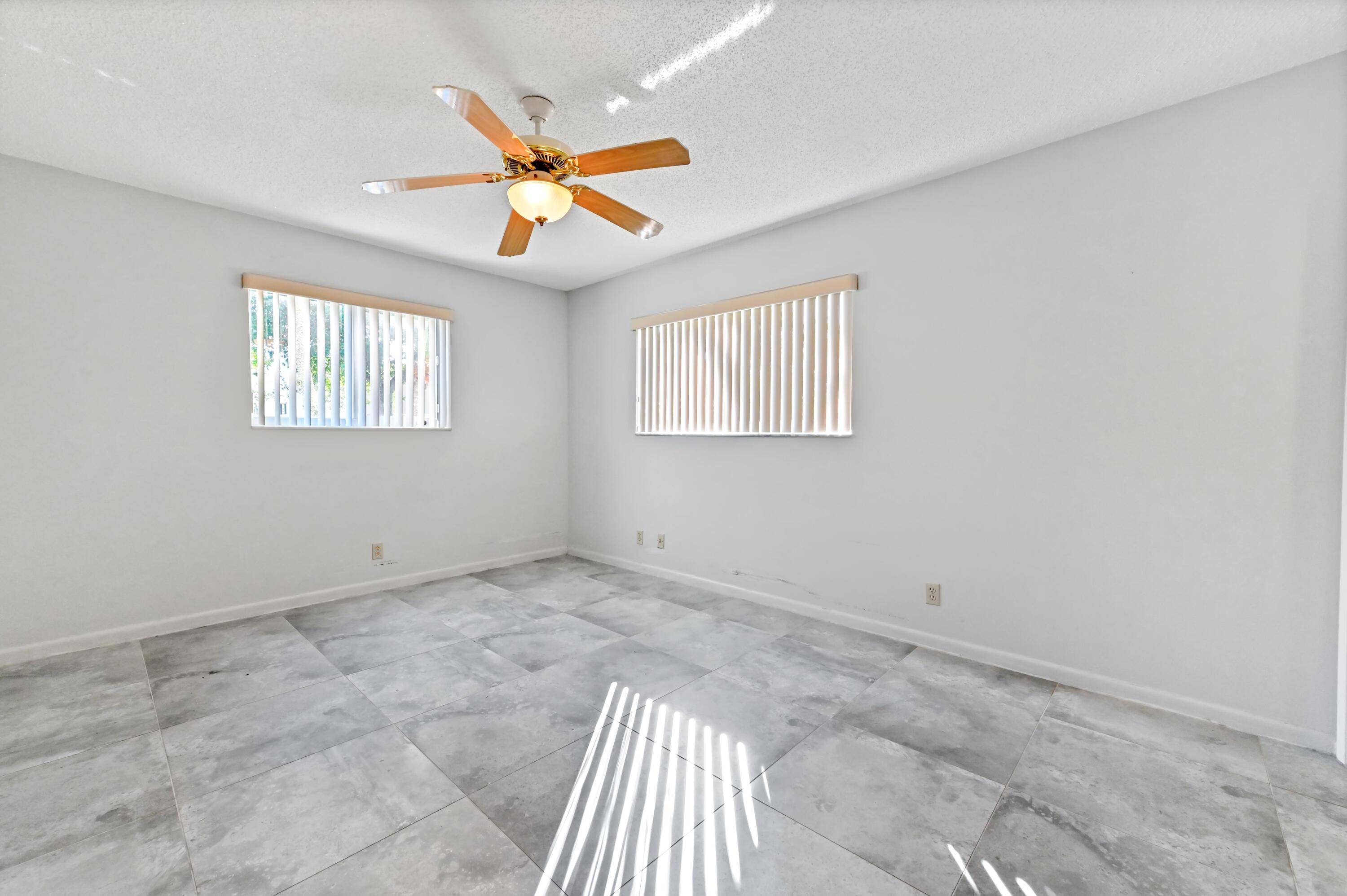 14895 Builtmore Way, Unit 107 Delray Beach, FL 33446 - Photo 19 of 40 a view of an empty room with a window