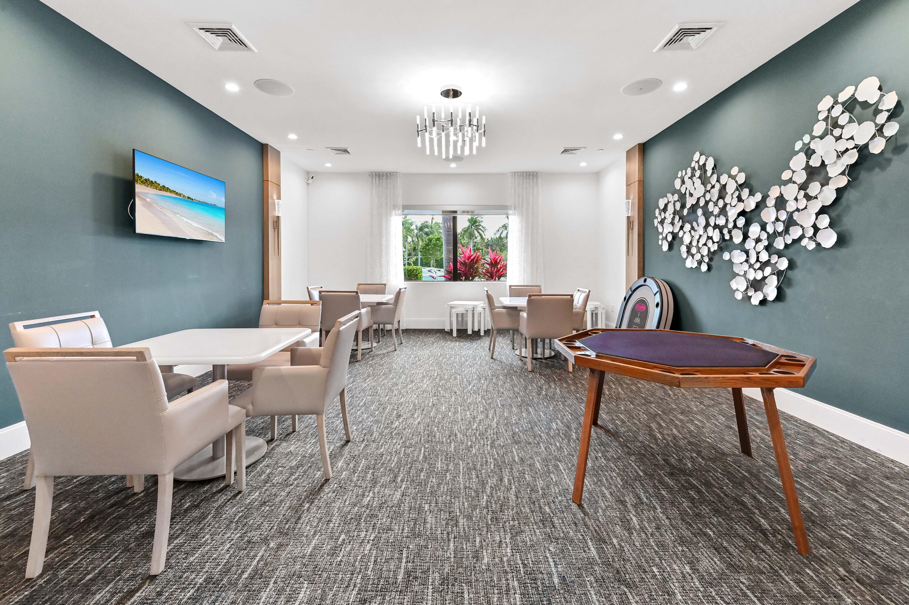 14895 Builtmore Way, Unit 107 Delray Beach, FL 33446 - Photo 30 of 40 a living room with furniture a chandelier and a rug