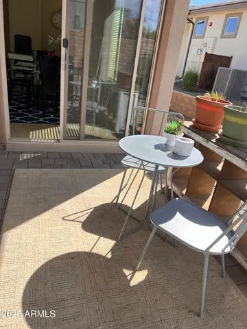 a view of a patio in a backyard