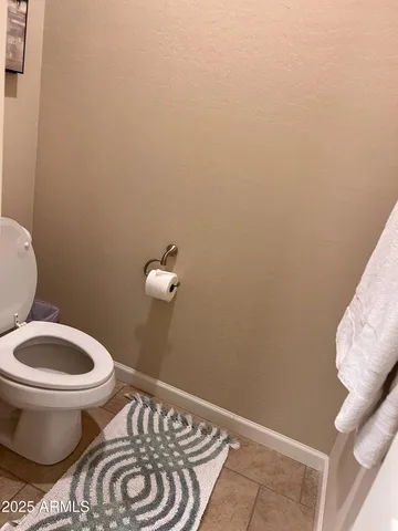 a bathroom with a toilet and a sink