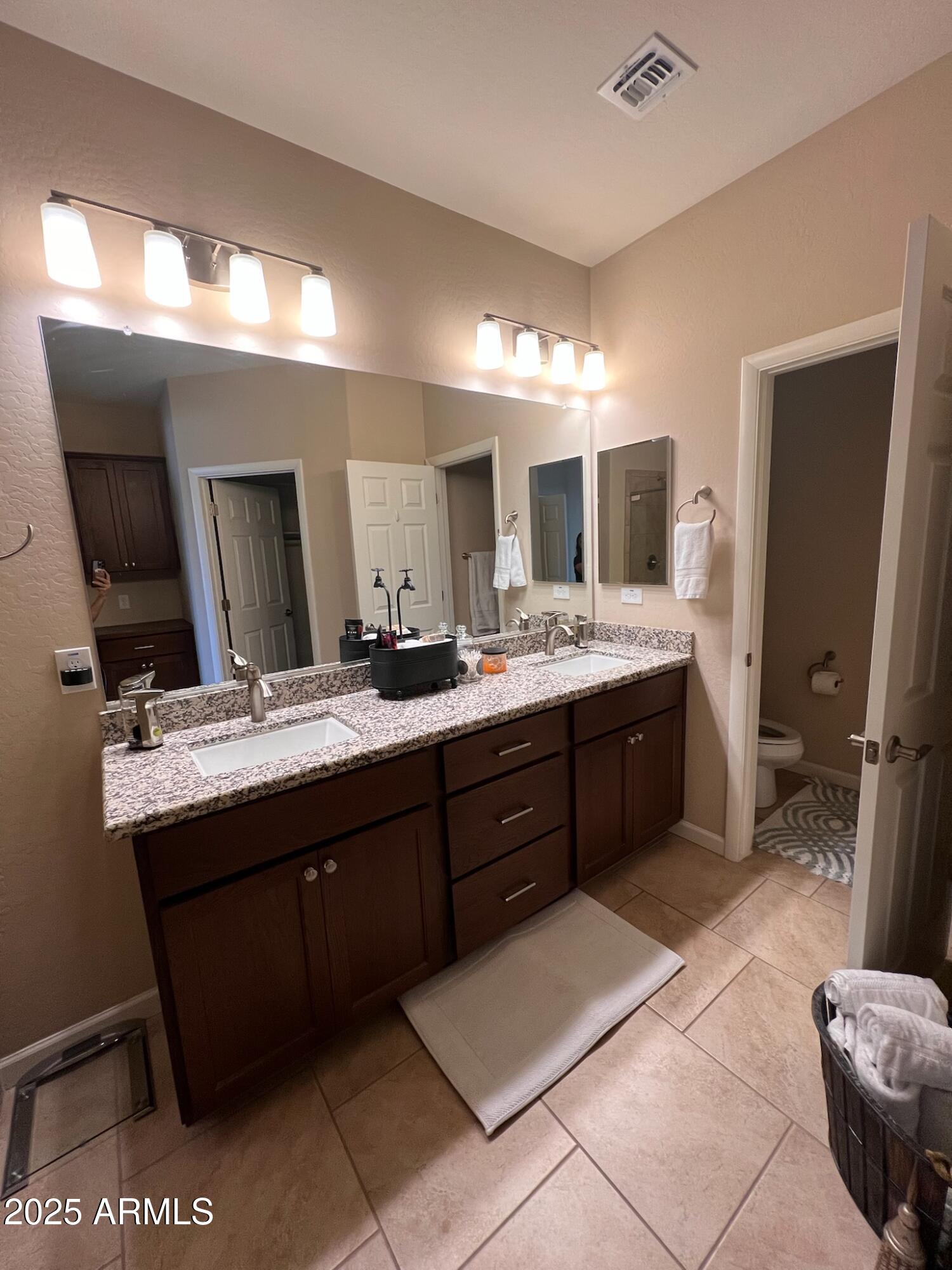 29316 North Lone Pine Lane Rio Verde, AZ 85263 - Photo 26 of 53 a spacious bathroom with a double vanity sink and a mirror