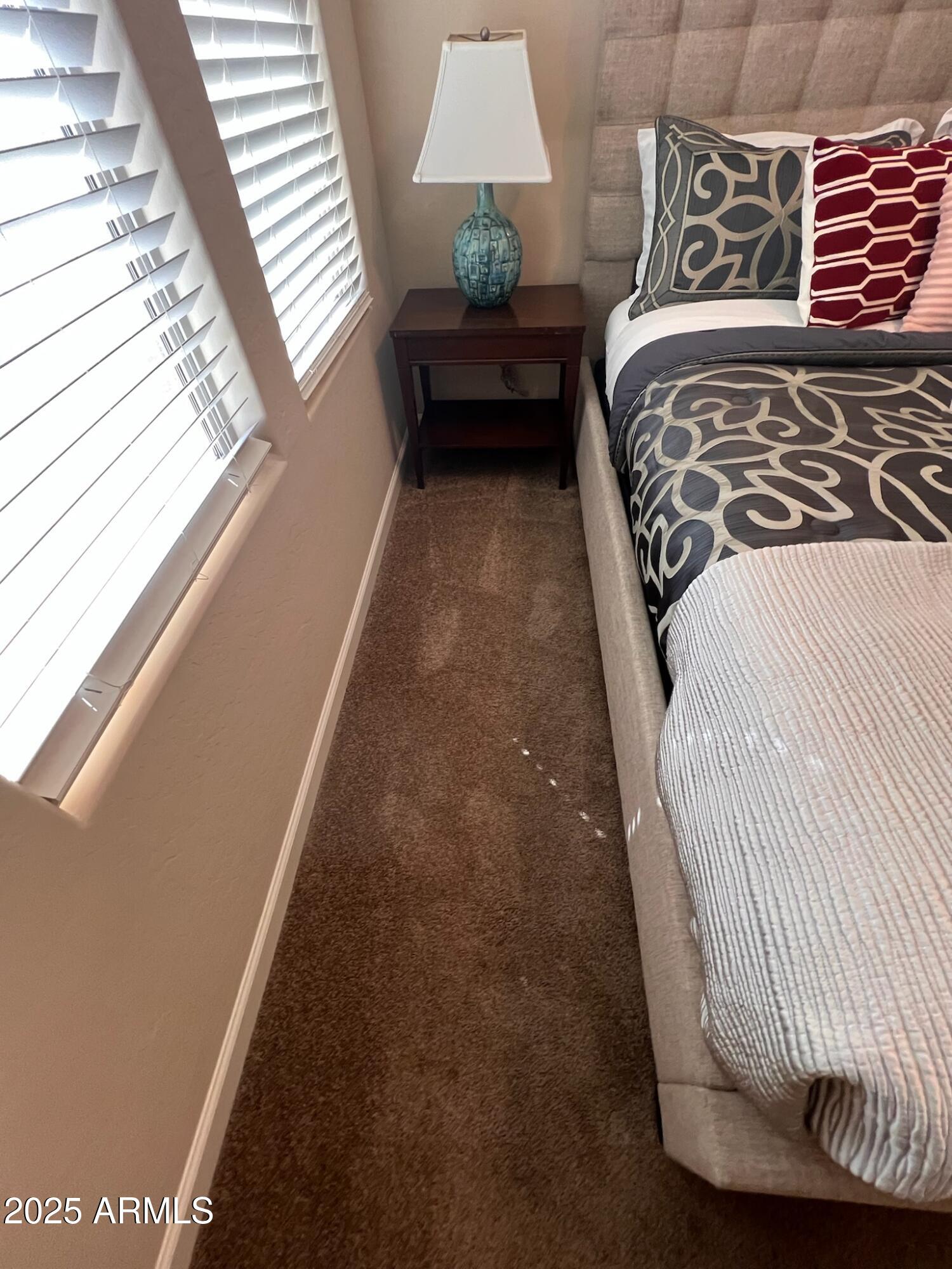 29316 North Lone Pine Lane Rio Verde, AZ 85263 - Photo 35 of 53 a bedroom with a bed and lamp