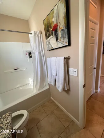 a bathroom with a walk in closet and shower