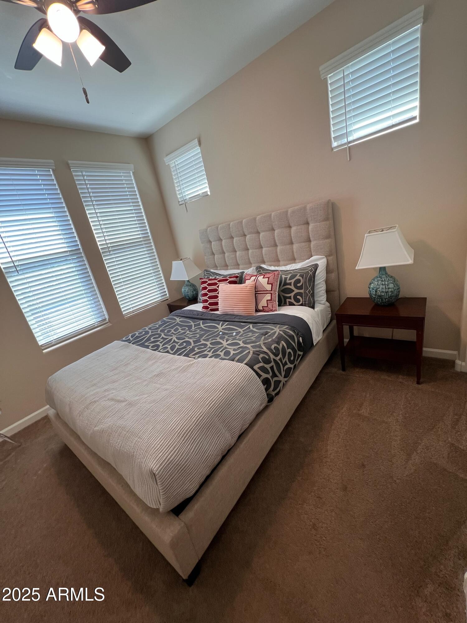 29316 North Lone Pine Lane Rio Verde, AZ 85263 - Photo 10 of 53 a bedroom with a bed lamp and a large window