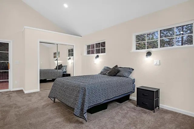 a bedroom with a bed and dresser