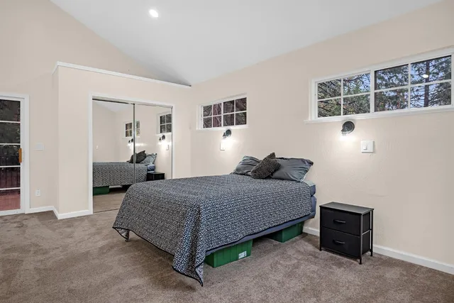 a bedroom with a bed and dresser