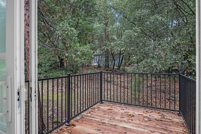 a view of a balcony with wooden floor