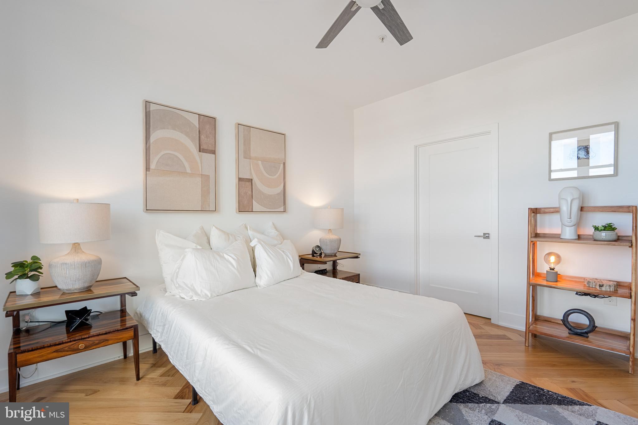 1345 K Street Southeast, Unit 401 Washington, DC 20003 - Photo 11 of 28 a bedroom with a bed and a dresser in it