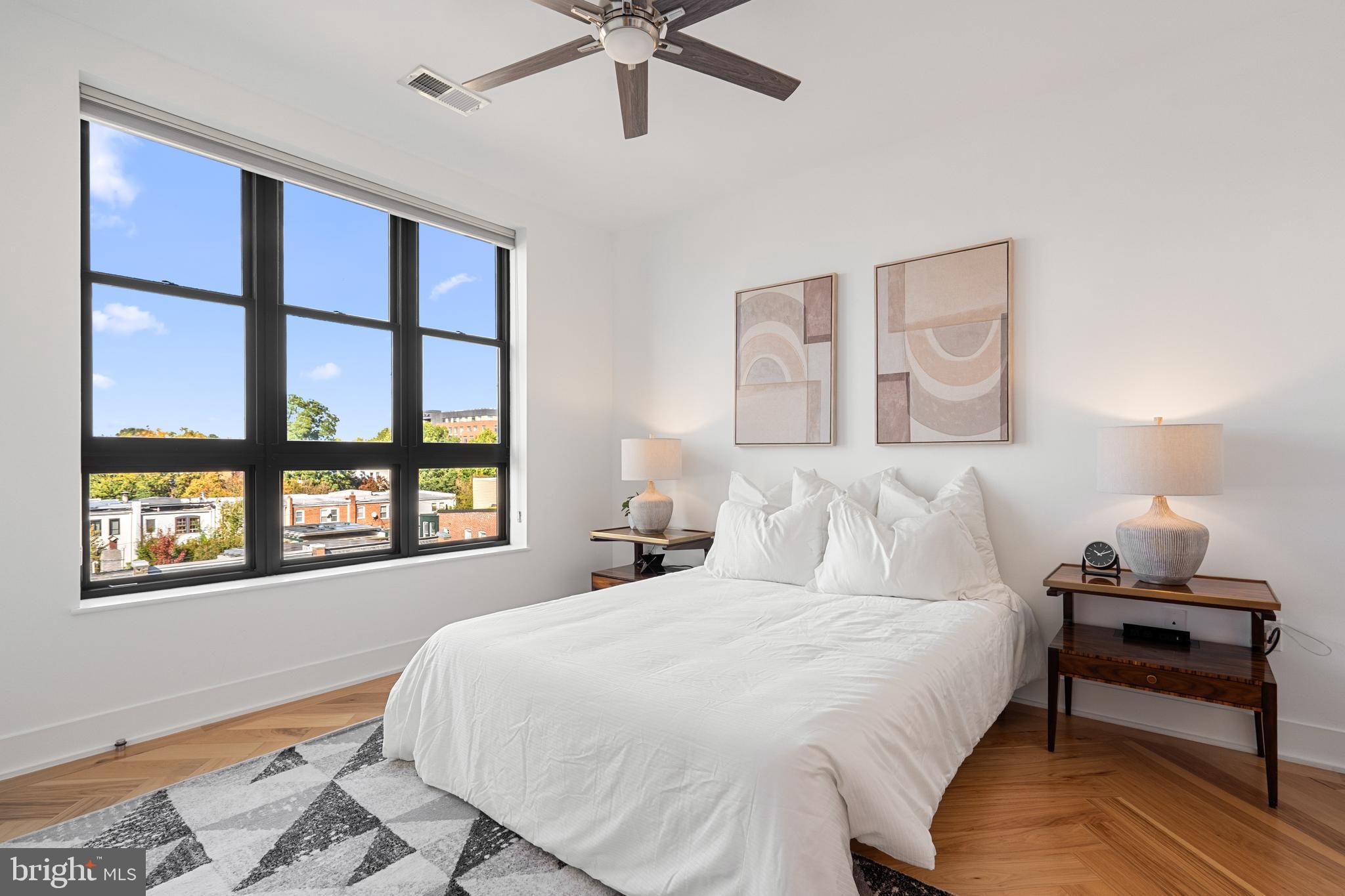 1345 K Street Southeast, Unit 401 Washington, DC 20003 - Photo 13 of 28 a bedroom with a bed and a window