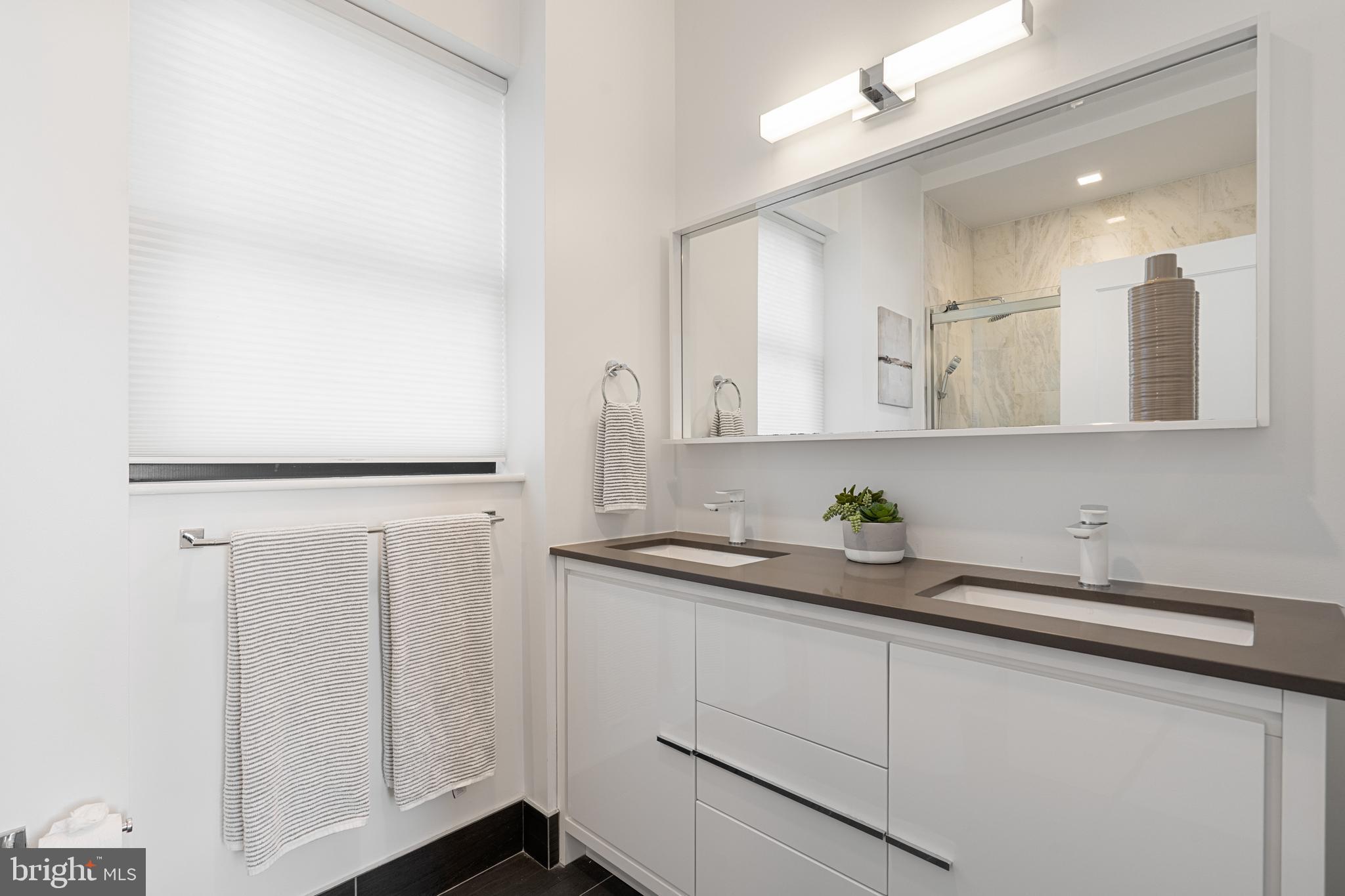 1345 K Street Southeast, Unit 401 Washington, DC 20003 - Photo 14 of 28 a kitchen with a sink and cabinets