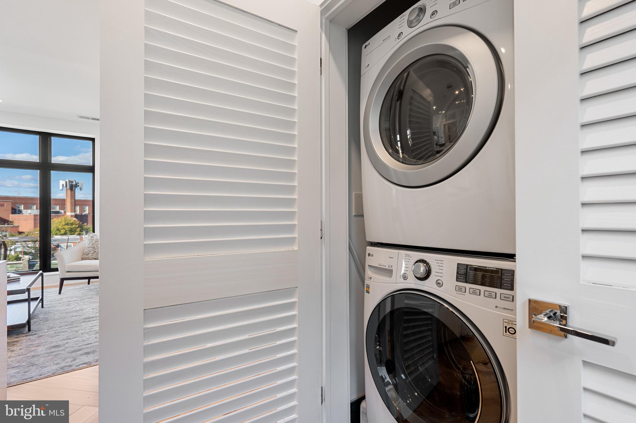 1345 K Street Southeast, Unit 401 Washington, DC 20003 - Photo 22 of 28 a view of a hallway with washer and dryer
