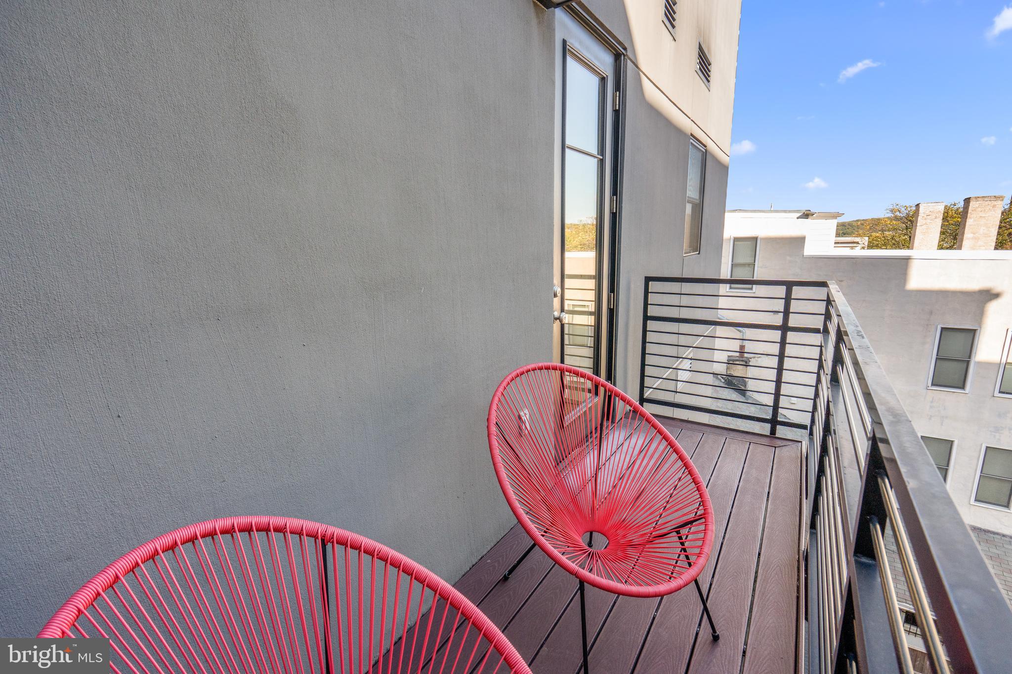 1345 K Street Southeast, Unit 401 Washington, DC 20003 - Photo 23 of 28 a view of a balcony with furniture and wooden floor