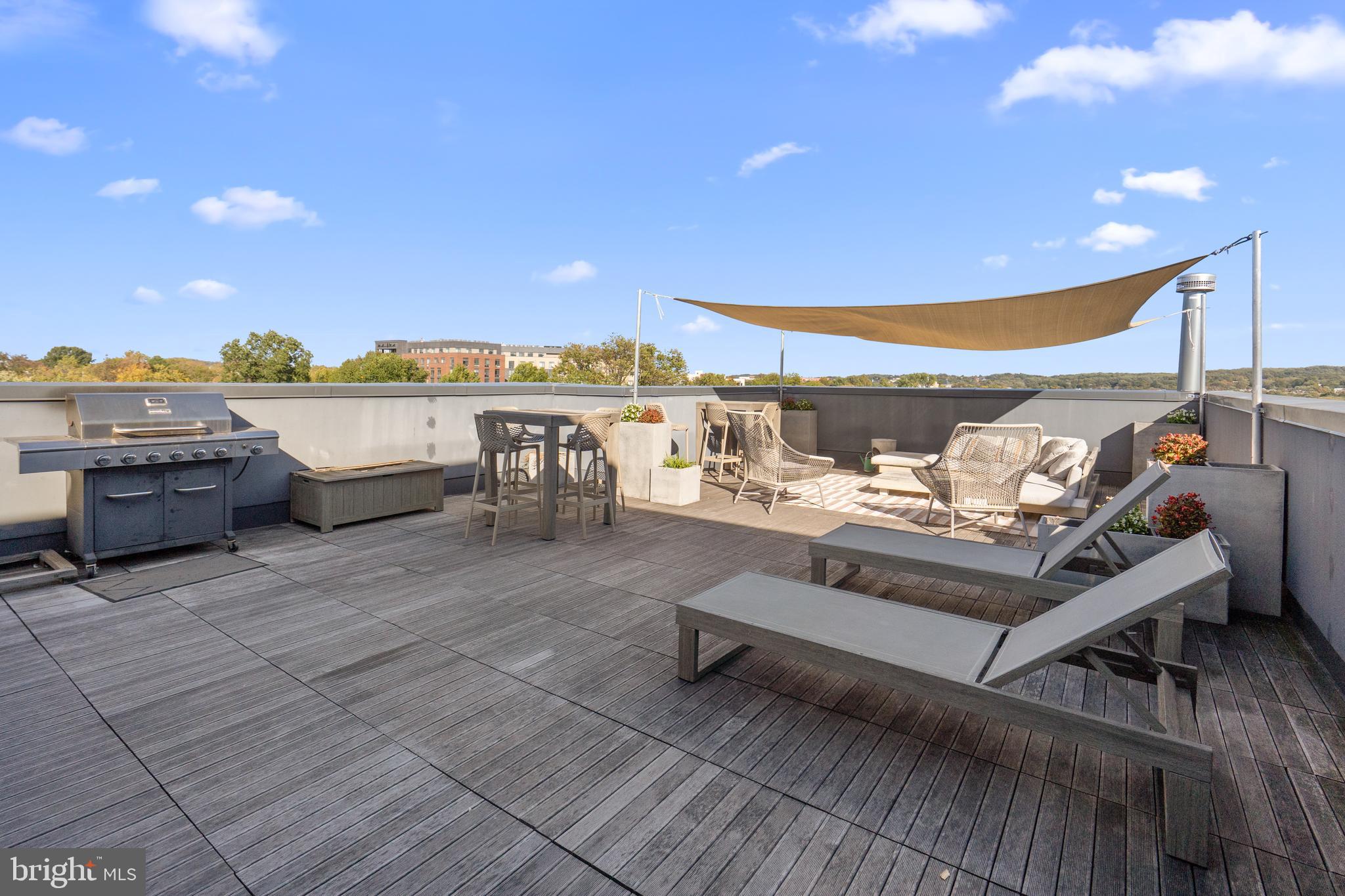 1345 K Street Southeast, Unit 401 Washington, DC 20003 - Photo 24 of 28 a view of a patio with couches and city view