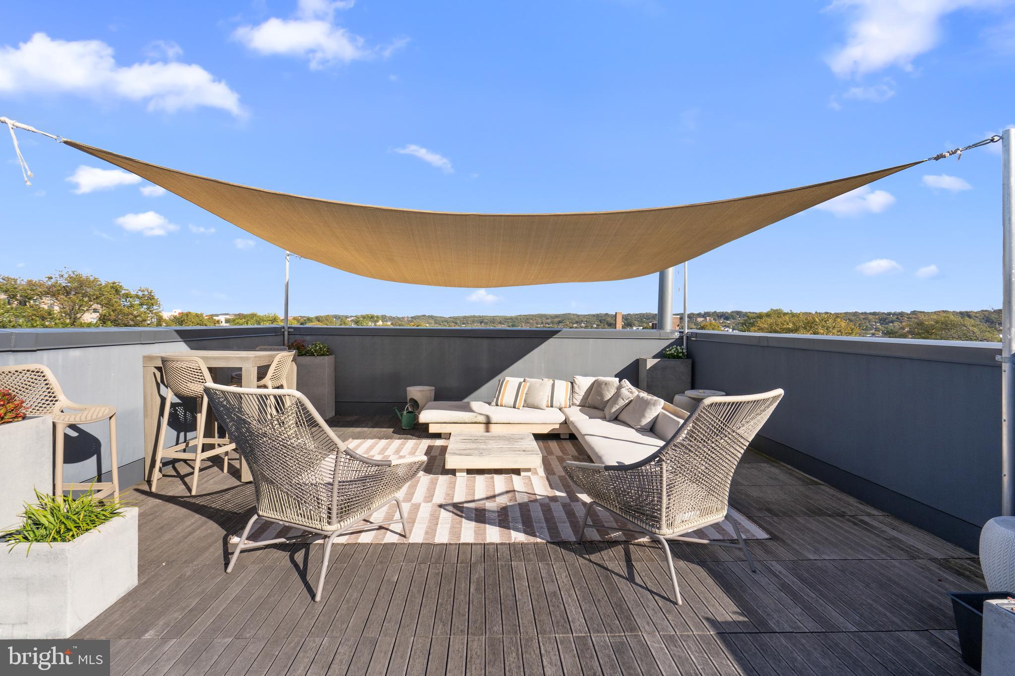 1345 K Street Southeast, Unit 401 Washington, DC 20003 - Photo 25 of 28 a view of a terrace with furniture and stove