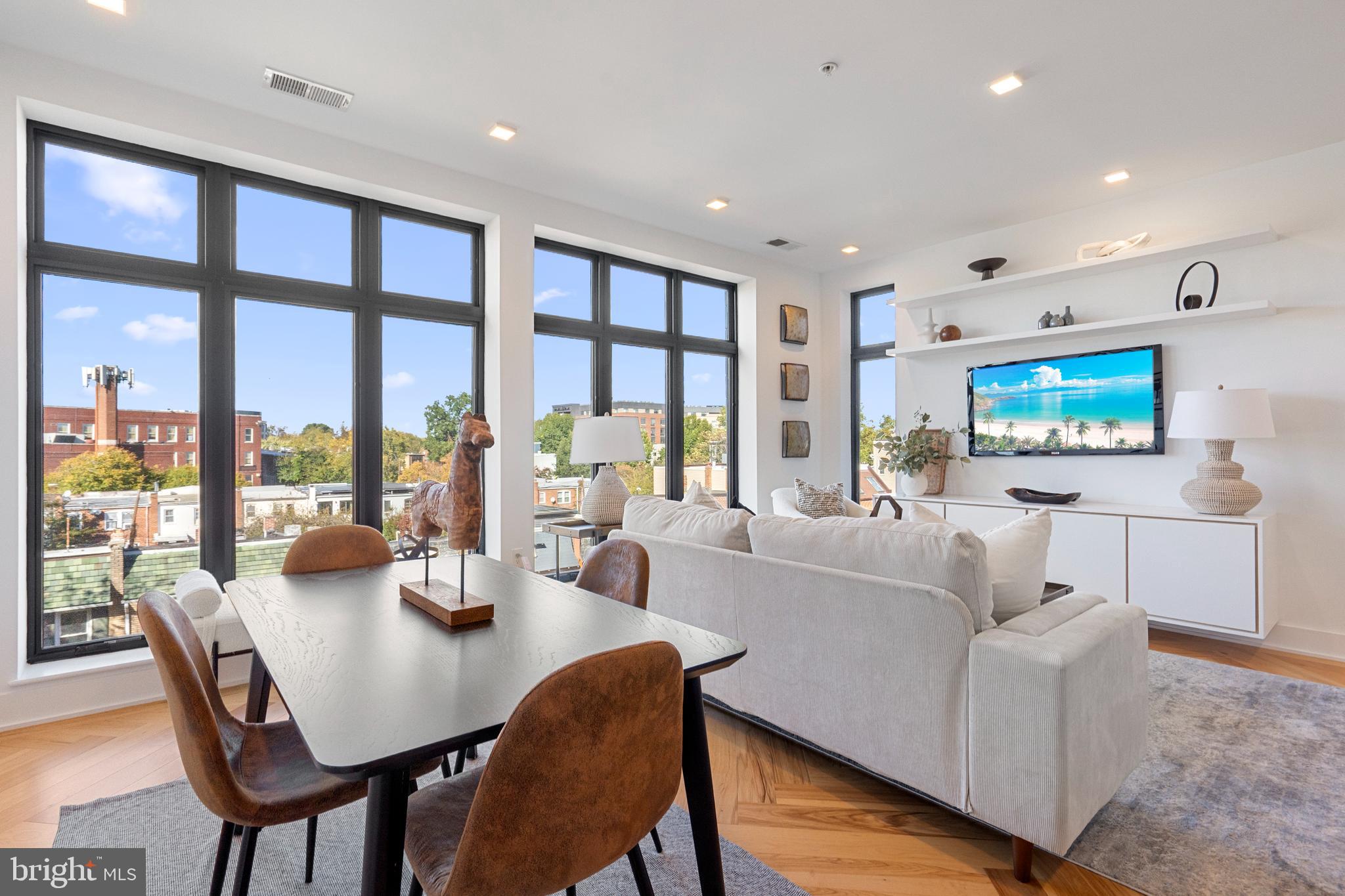 1345 K Street Southeast, Unit 401 Washington, DC 20003 - Photo 3 of 28 a living room with furniture and a flat screen tv