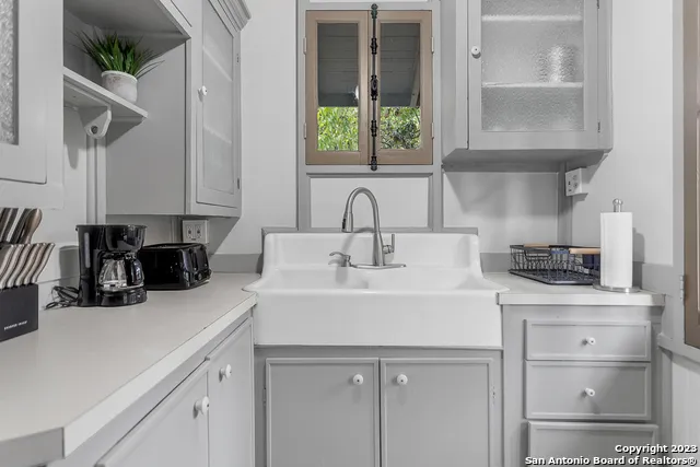 a kitchen with a sink and cabinets