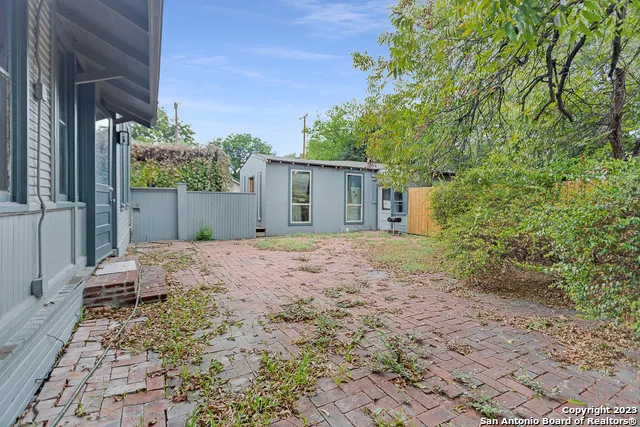 a backyard of a house with lots of green space
