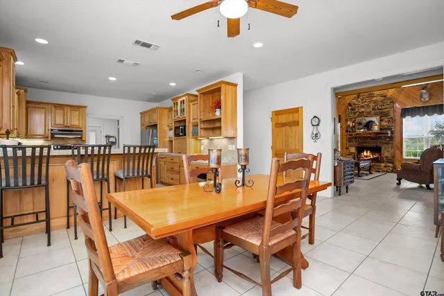 a dining room with furniture and window