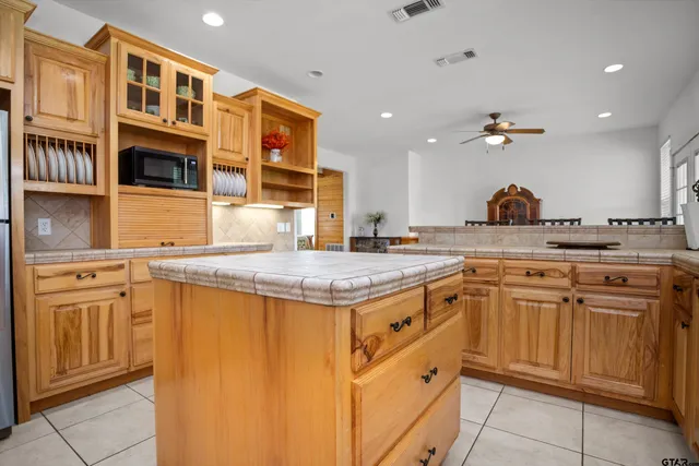 a kitchen with stainless steel appliances granite countertop a stove and a sink
