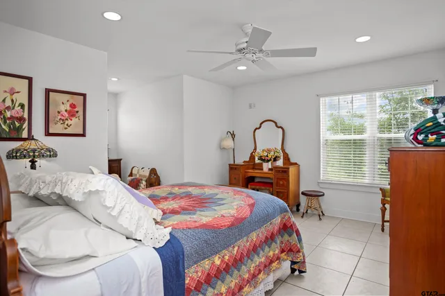 a bedroom with a bed and a table in it