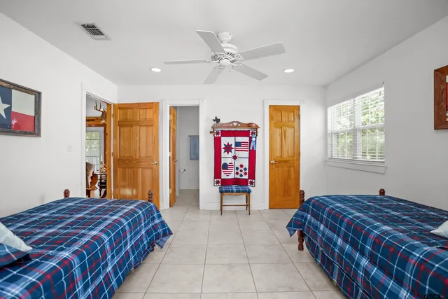 a bedroom with a bed and dresser