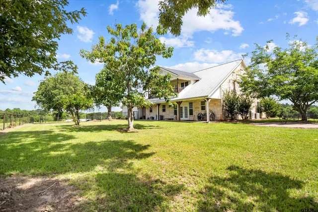 a view of a house with a big yard