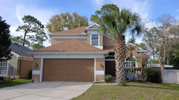 front view of a house with a yard