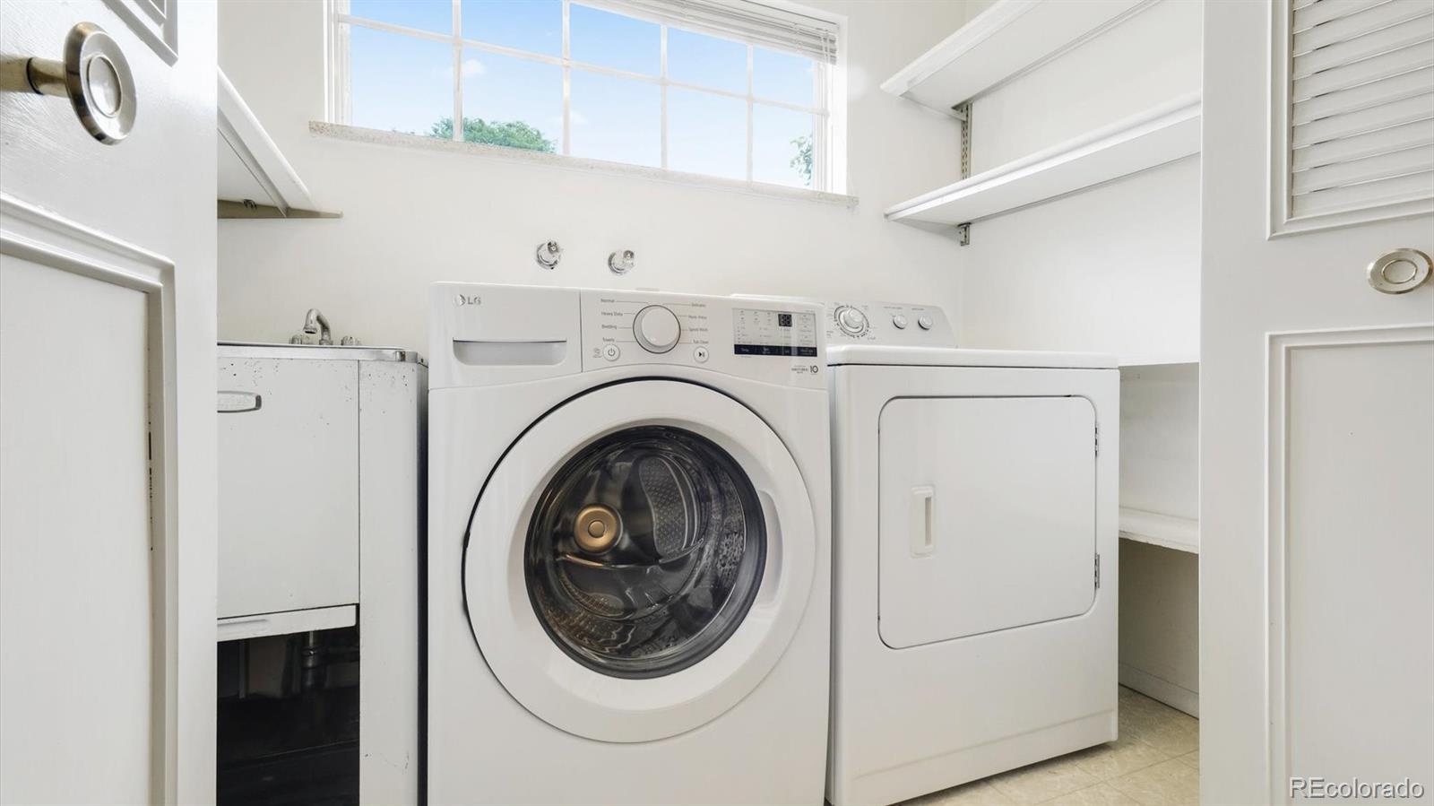 3292 South Oneida Way Denver, CO 80224 - Photo 18 of 44 a utility room with dryer and washer