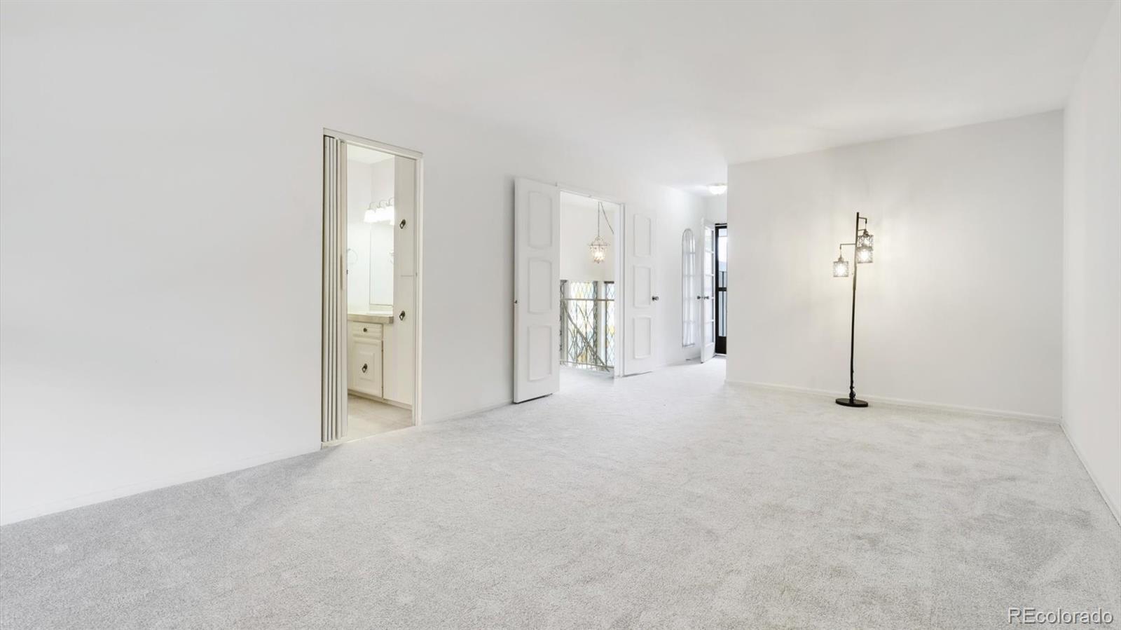 3292 South Oneida Way Denver, CO 80224 - Photo 23 of 44 a view of empty room with floor to ceiling window