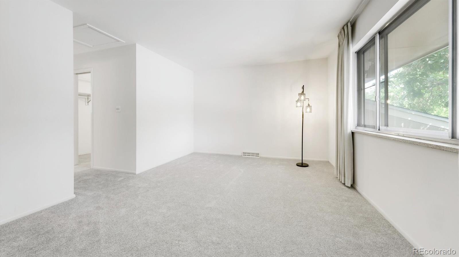 3292 South Oneida Way Denver, CO 80224 - Photo 29 of 44 a view of a room that has a window in it