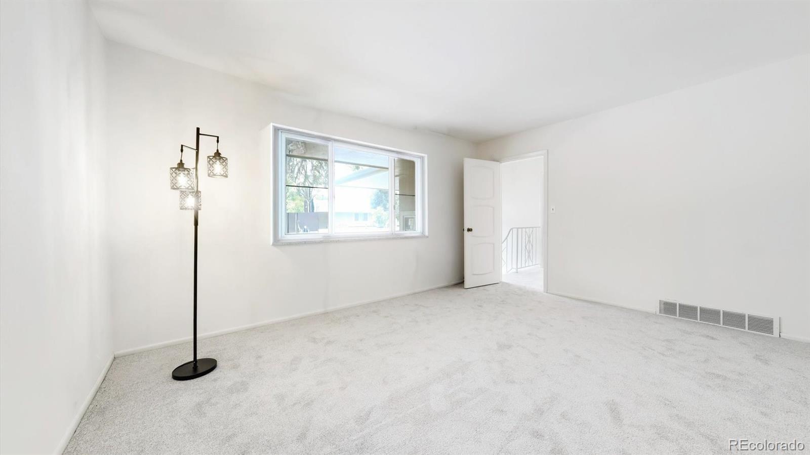 3292 South Oneida Way Denver, CO 80224 - Photo 30 of 44 an empty room with windows