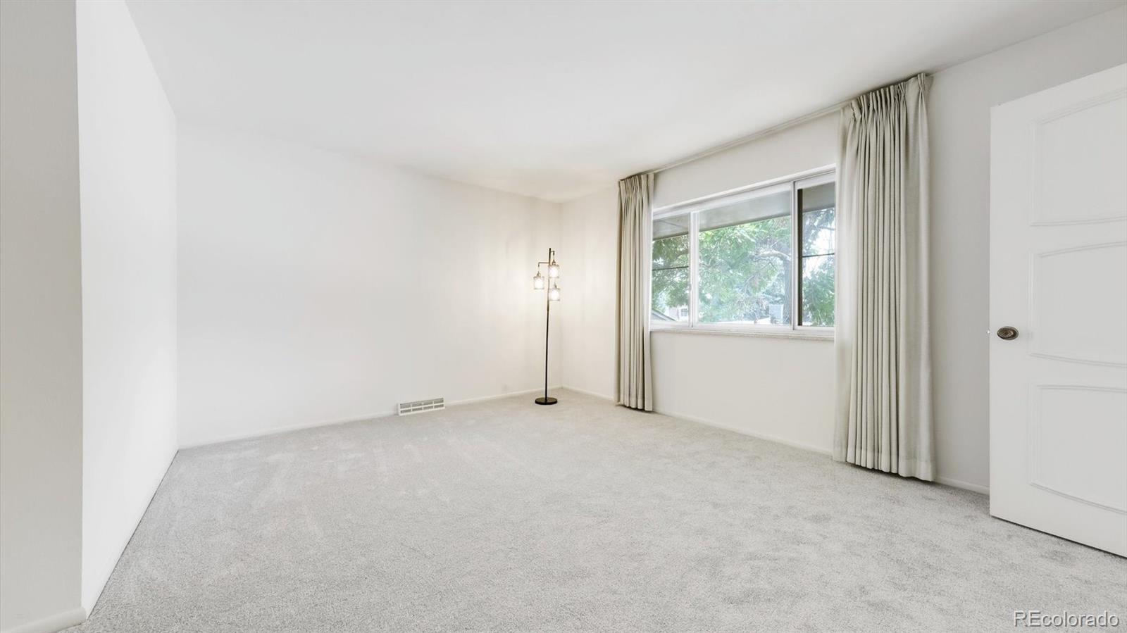 3292 South Oneida Way Denver, CO 80224 - Photo 31 of 44 an empty room with windows