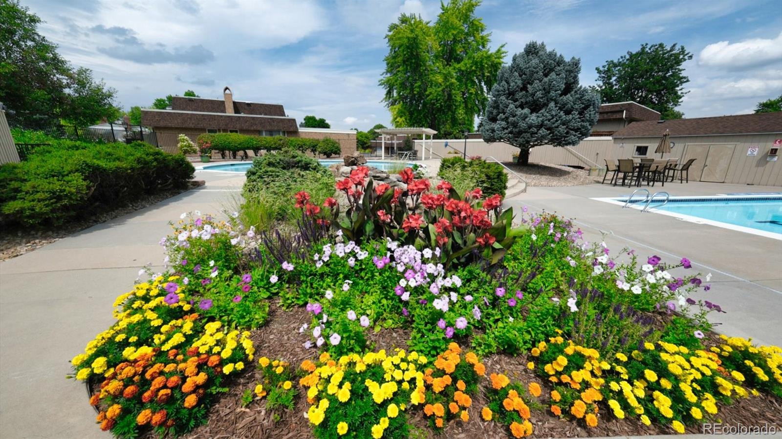 3292 South Oneida Way Denver, CO 80224 - Photo 38 of 44 a view of a garden with flowers and flowers