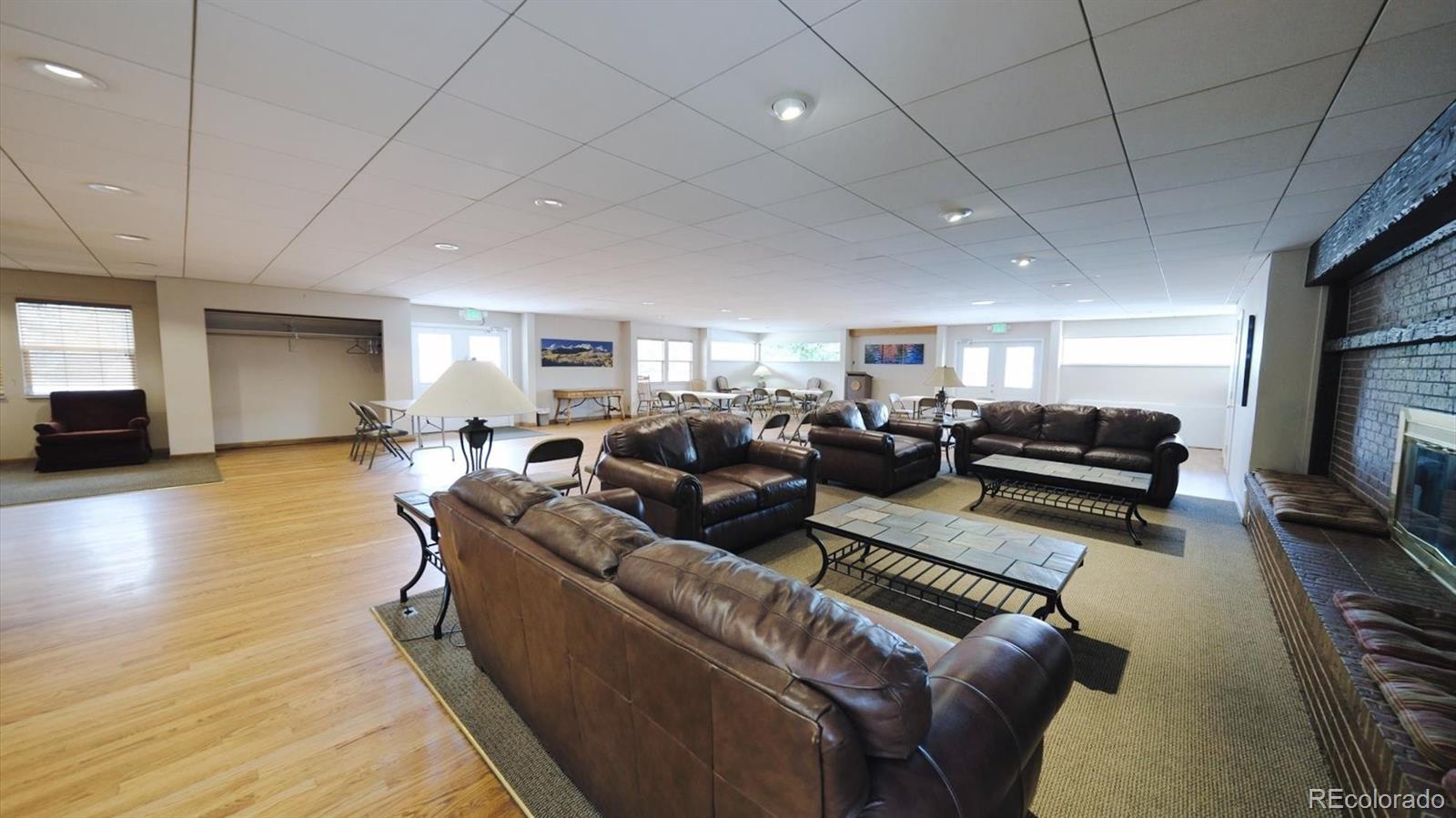 3292 South Oneida Way Denver, CO 80224 - Photo 39 of 44 a living room with furniture and a flat screen tv